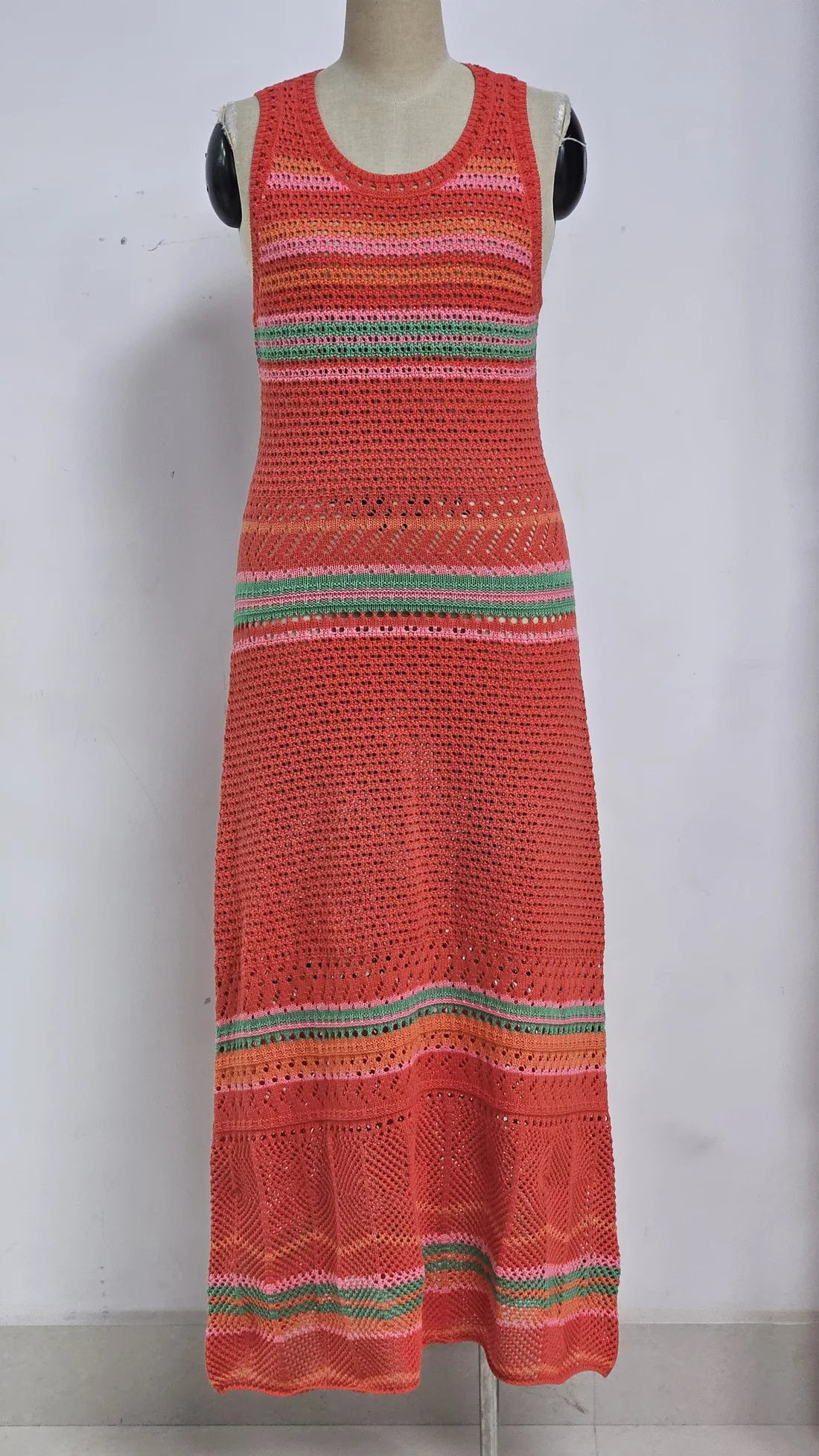 Red openwork knit dress with colour stripes, chevron effects and a long silhouette