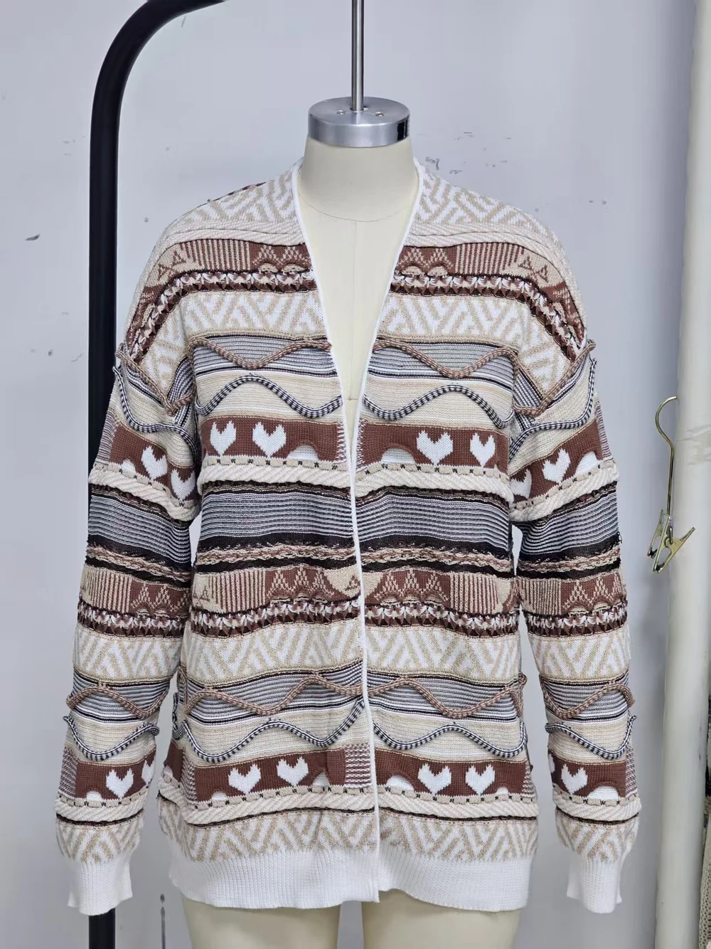 Multi-pattern cardigan with contrasting colour bands and raised surface details