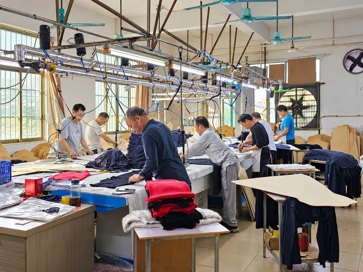 Garment pressing workstations where knitted garments are shaped and finished